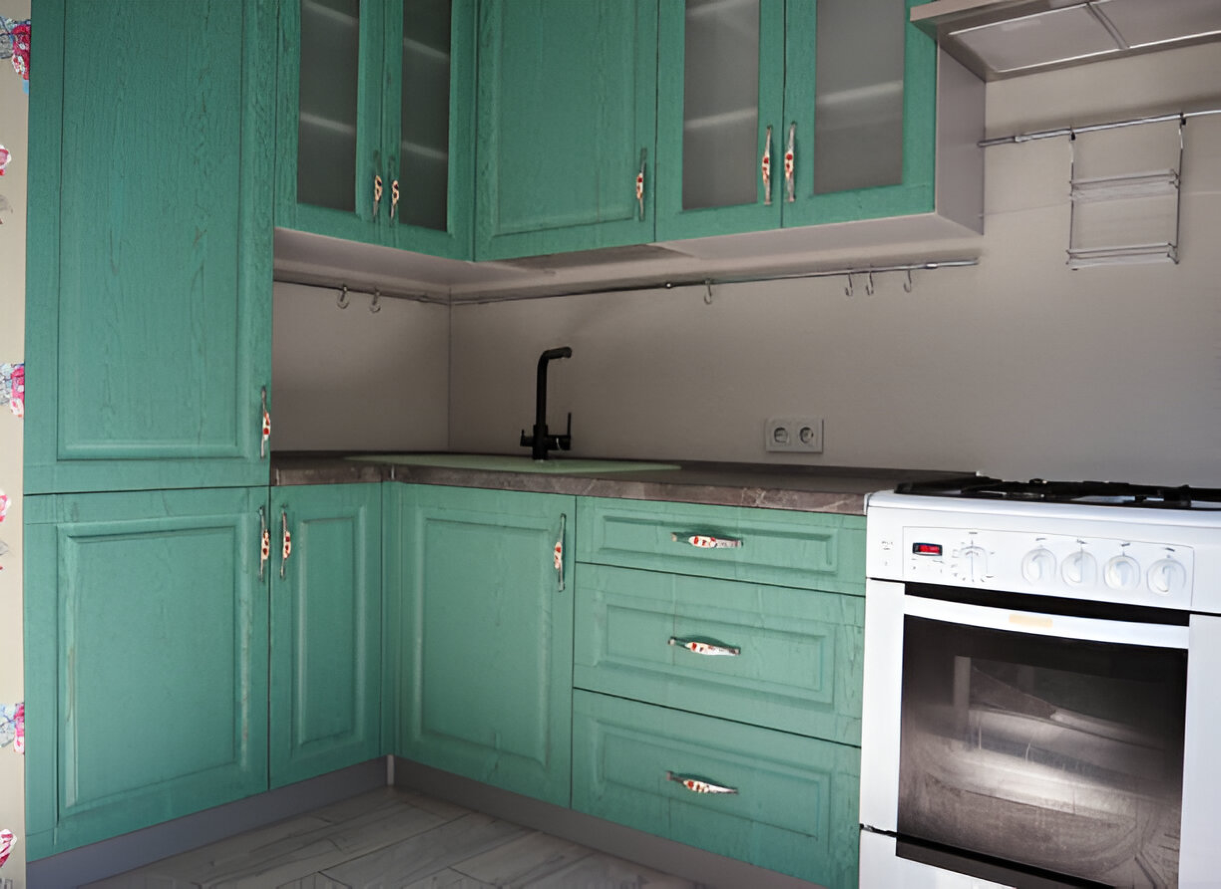 Close-up view of modern kitchen cabinets with a fresh green finish, showcasing a clean and organized space perfect for preparation before painting.